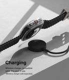 Galaxy Watch Ultra | Slim & Glass - A Galaxy Watch Ultra in a clear protective case hovering above a wireless charging puck.