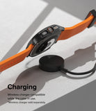 Galaxy Watch Ultra | Slim Extend & Glass - A Galaxy Watch Ultra with an orange band hovering over a wireless charger.