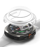 Galaxy Watch Ultra | Slim & Glass - A transparent protective case and screen protector hovering above a Galaxy Watch Ultra.