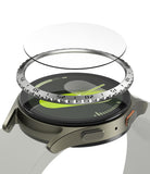 Galaxy Watch 7 (44mm) | Bezel Styling & Glass - Exploded view of a smartwatch with a metallic bezel ring and glass protector.