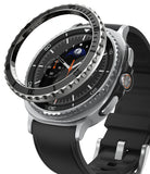 Galaxy Watch 8 Classic 46mm | Bezel Styling Premium - A black metal bezel ring hovering above a silver smartwatch.