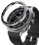 Galaxy Watch 8 Classic 46mm | Bezel Styling Premium - A metallic bezel ring hovering above a smartwatch with a black leather strap and moon dial.