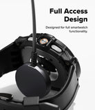 Galaxy Watch 8 Classic 46mm Case + Band | Rugged Gear - Black rugged watch case charging on a magnetic dock.