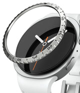 Galaxy Watch 9 / 8 40mm | Bezel Styling - A close-up of a smartwatch with a white band and silver case, showing a clear bezel protector ring with black printed numerals and white hands partially covering the black watch face.