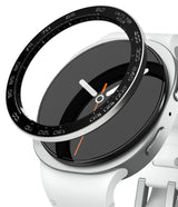 Galaxy Watch 9 / 8 40mm | Bezel Styling Premium - Close-up of a smartwatch with a white silicone strap, a black round face, and a black bezel ring featuring white numerals and white hands with an orange second hand.