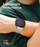 Galaxy Watch 9 / 8 44mm Case | Slim - A close-up of a person's wrist wearing a smartwatch with a light gray band and black round face, over a dark green shirt. White text reads 'Lightweight Performance' and 'Weight 1.