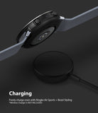 Galaxy Watch Active 2 (44mm) | Air Sports Black + Bezel Styling - Smartwatch hovering over a circular wireless charger.