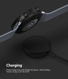 Galaxy Watch Active 2 (44mm) | Air Sports Black + Bezel Styling - Smartwatch with protective case hovering over charger.