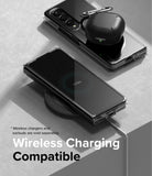 Galaxy Z Fold 4 Case | Slim - A clear phone case on a Galaxy Z Fold 4 charging wirelessly with earbuds on top.