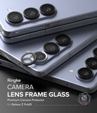 Galaxy Z Fold 5 | Camera Lens Frame Glass - Black lens protectors being applied to the triple camera array of a phone.
