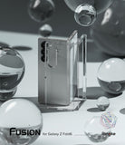 Galaxy Z Fold 6 Case | Fusion - Clear - Clear protective case standing next to a silver Galaxy Z Fold 6 amid glass spheres.