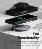 Galaxy Z Fold 6 Case | Slim - A black phone in a slim case wirelessly charging on a circular pad with earbuds nearby.