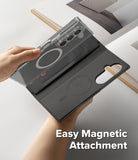 Galaxy Z Fold 7 Cover | Folio Grip Wallet Magnetic - Hands holding a clear phone case attaching magnetically to a black folio wallet with card slots.