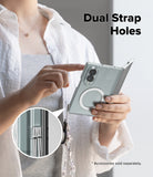 Galaxy Z Fold 8 | Fusion Magnetic - A person holds a silver foldable smartphone in a clear protective case with a circular MagSafe ring and a dangling cord. The image includes the text 'Dual Strap Holes' and a circular inset showing the cord threaded through the strap holes of the case.