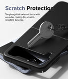 Galaxy Z Flip 4 Case | Slim - A metal key resting on a black protective phone case, demonstrating scratch resistance.