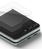 Galaxy Z Flip 5 Screen Protector | Cover Display Glass - Galaxy Z Flip 5 Screen Protector - A transparent glass cover floating above the folded Galaxy Z Flip 5 cover display.