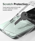 Galaxy Z Flip 5 Case | Slim - A metal key scratches against a clear phone case on a light green Galaxy Z Flip 5.