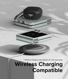 Galaxy Z Flip 5 Case | Slim - A folded Galaxy Z Flip 5 with earbuds on a wireless charging pad on a textured surface.