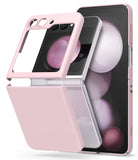 Galaxy Z Flip 5 Case | Slim Color - Light pink two-piece protective case being installed on a silver Galaxy Z Flip 5.