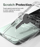 Galaxy Z Flip 5 Case | Slim Hinge - Clear - A key pressing against a clear phone case to demonstrate scratch resistance.