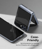 Galaxy Z Flip 7 FE | 3-in-1 Protector - A partially folded blue phone with a clear protective film being applied.