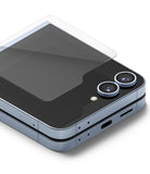 Galaxy Z Flip 6 Screen Protector | Cover Display Glass (2 Pack) - Galaxy Z Flip 6 Screen Protector - Tempered glass being applied to the cover display of a folded Galaxy Z Flip 6 phone.