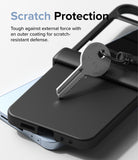 Galaxy Z Flip 7 FE Case | Slim Hinge - A metal key resting on a black phone case, demonstrating scratch-resistant protection.