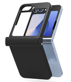 Galaxy Z Flip 7 FE Case | Slim Hinge Magnetic - Black protective case partially installed on a light blue foldable phone.