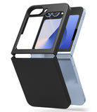 Galaxy Z Flip 7 FE Case | Slim Magnetic - A light blue foldable phone partially fitted with a slim, matte black protective case.