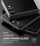 Galaxy Z Flip 7 | Camera Lens Frame Glass (2 Pack) - Two black camera lens protectors hovering over a Galaxy Z Flip 7 phone.