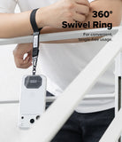 Holder Link Tactical Cam Buckle Hand Strap - A black swivel ring wrist strap with a metal clip holding a white smartphone case, shown being worn on a person's wrist while leaning on a white railing. Text on the image reads '360° Swivel Ring' and 'For convenient, tangle-free usage.