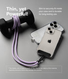 Holder Link Strap | Clear - A light purple phone lanyard wrapped around a dumbbell, attached to a clear phone case on a gray surface.