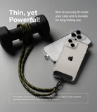 Holder Link Strap | Clear - Khaki rope strap attached to a clear phone case, resting next to a black dumbbell on a gray surface.