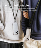 Holder Link Strap | Black - Two people wearing smartphones on adjustable black and olive rope straps over hoodies.