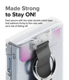 Galaxy Z Flip 6 / 5 / 4 / 3 | Hinge Cover - Clear hinge cover with a black strap and metal ring attached to a phone case.