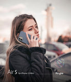 iPhone 12 Mini Case | Air-S - Woman in a black jacket holding a blue iPhone 12 Mini to her ear outdoors.