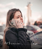 iPhone 12 Mini Case | Air-S - Woman in a black jacket talking on a beige iPhone 12 Mini with an Air-S case outdoors.