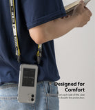 iPhone 12 Mini Case | Fusion Design - Clear phone case with a yellow and black branded lanyard worn over the shoulder.