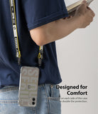 iPhone 12 Mini Case | Fusion Design - Person wearing a phone case with a yellow and black branded lanyard strap.