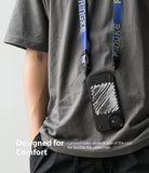 iPhone 12 Mini Case | Onyx Design - Person wearing a black phone case with white brushstroke art hanging from a blue lanyard.