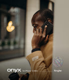 iPhone 12 Mini Case | Onyx - Man in tan coat talking on an iPhone 12 Mini with a black Onyx case.