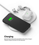 iPhone 12 Mini Case | Onyx - Black phone case and white AirPods Pro case charging wirelessly on a white charging pad.