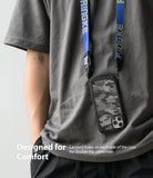 iPhone 12 Pro Max Case | Fusion-X - Camouflage phone case hanging from a blue branded lanyard around a person's neck.