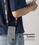 iPhone 12 Pro Max Case | Fusion Design - Person wearing a phone case with a yellow branded lanyard attached to both sides.