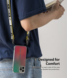 iPhone 12 Pro Max Case | Fusion Design - Person wearing a phone case with a yellow lanyard attached to side holes.