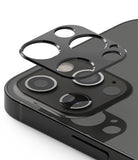 iPhone 12 Pro | Camera Styling - A black protective lens cover hovering above the triple-camera array of a dark iPhone.