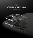 iPhone 12 Pro | Camera Styling - A metallic camera lens protector hovering above the triple-lens array of a black iPhone 12 Pro.