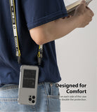 iPhone 12 / 12 Pro Case | Fusion Design - Person wearing a phone case with a yellow lanyard attached to dual side holes.