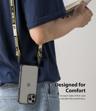 iPhone 12 / 12 Pro Case | Fusion - A person wearing a phone case with a yellow branded lanyard attached to side holes.