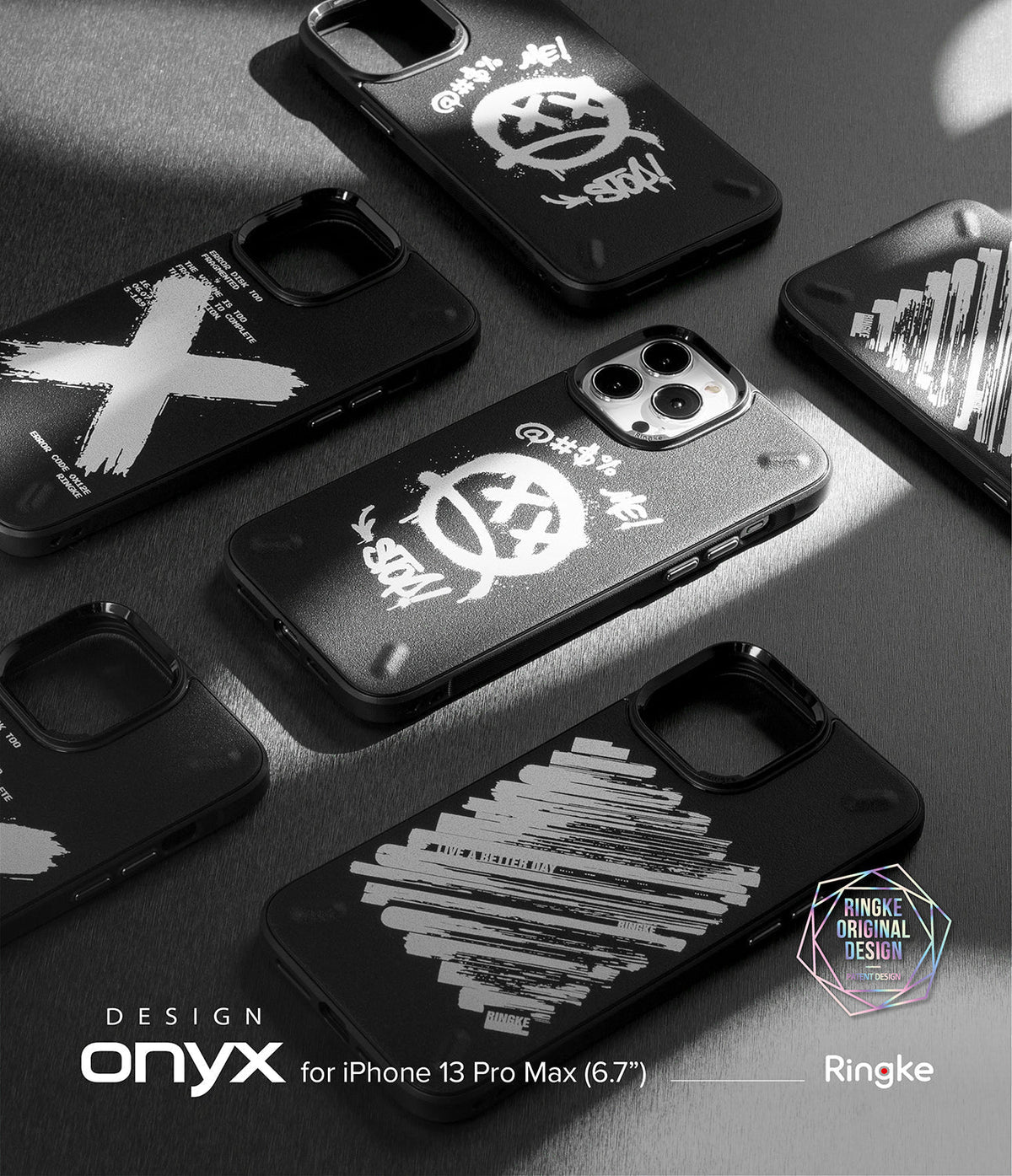 iPhone 13 Pro Max Case | Onyx Design - Multiple black phone cases with white graffiti-style graphics arranged on a dark surface.